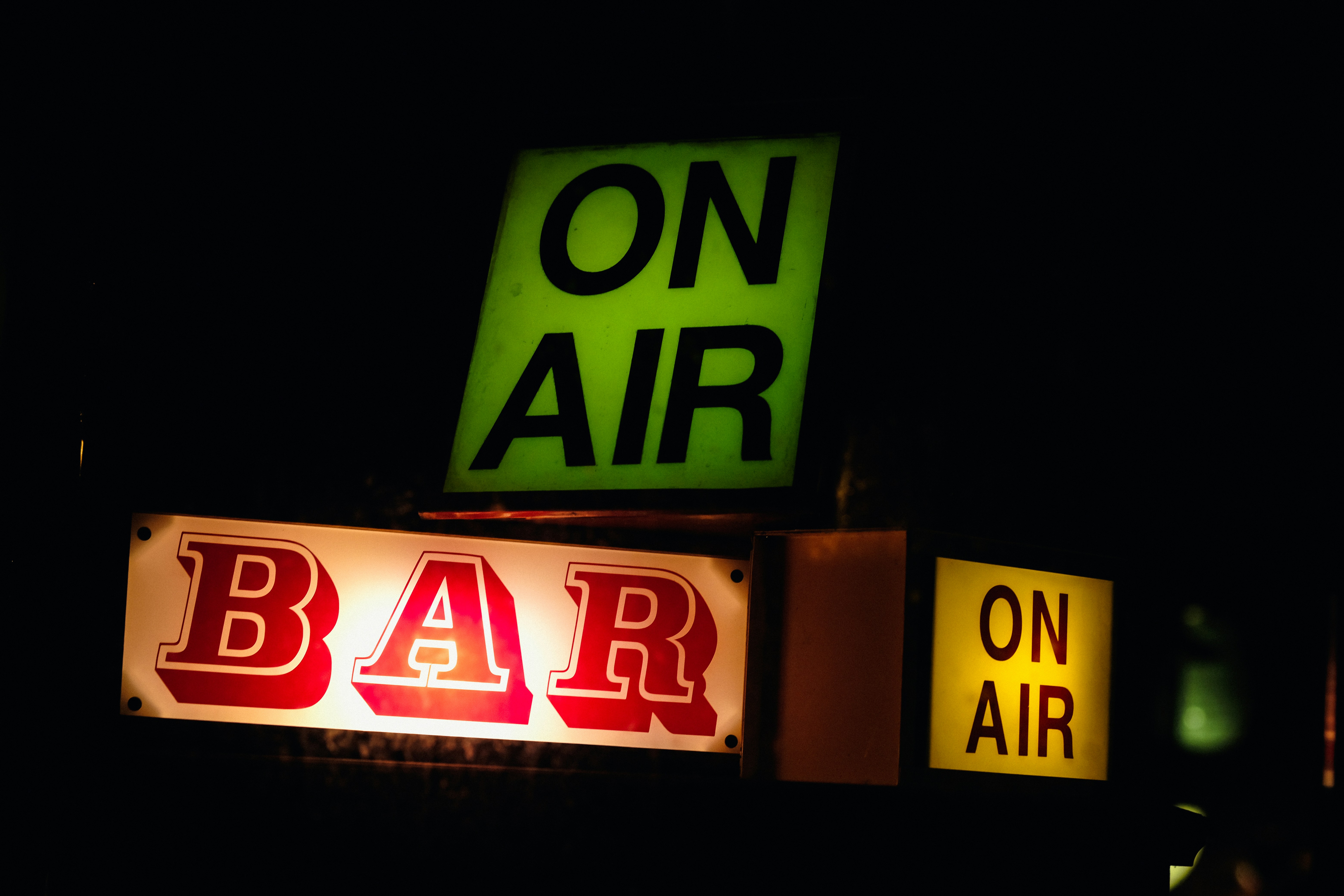 Illuminated On Air sign outside a bar, great for podcasts about nightlife or entertainment